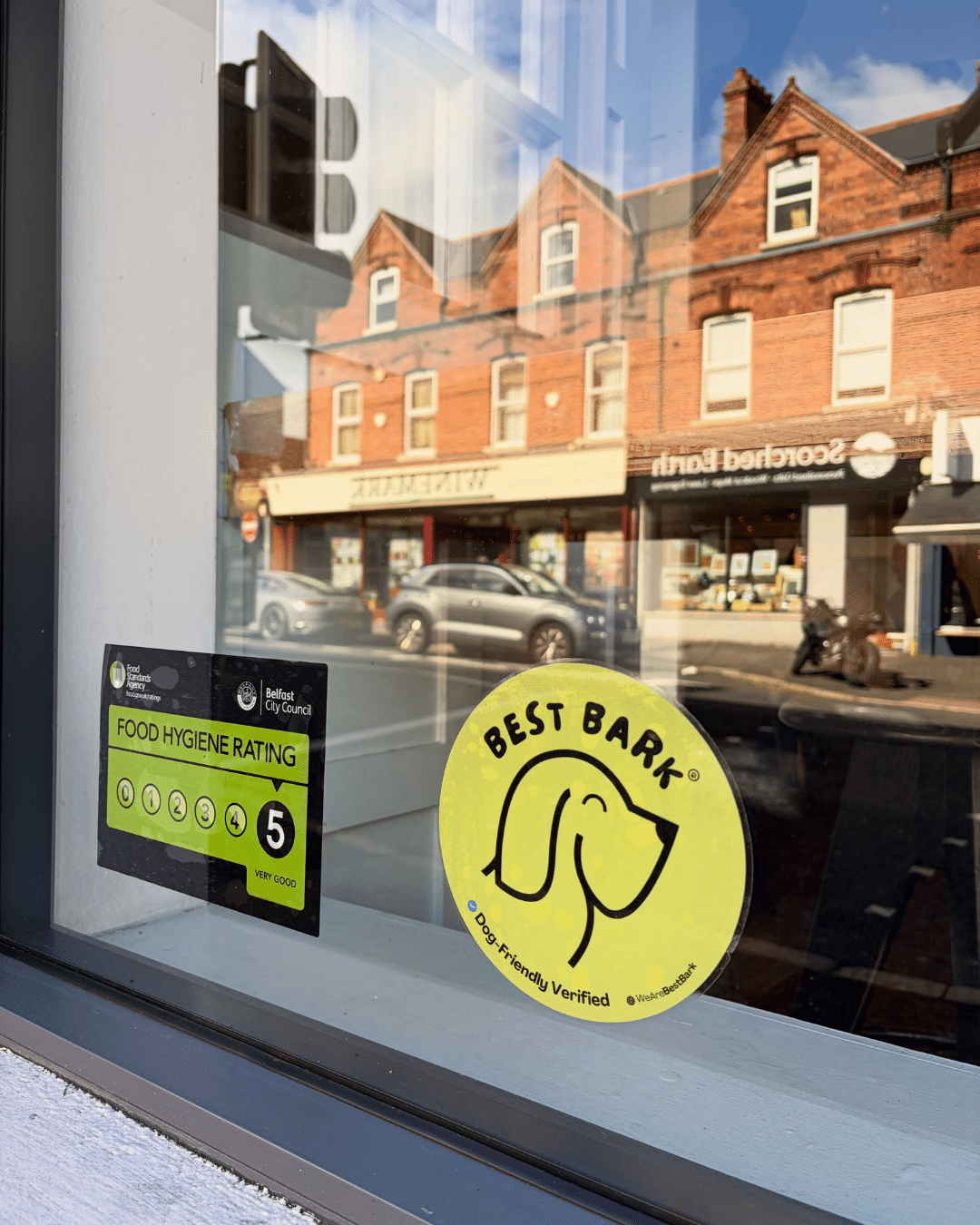 Best Bark Dog Friendly Verified decal displayed in a business window